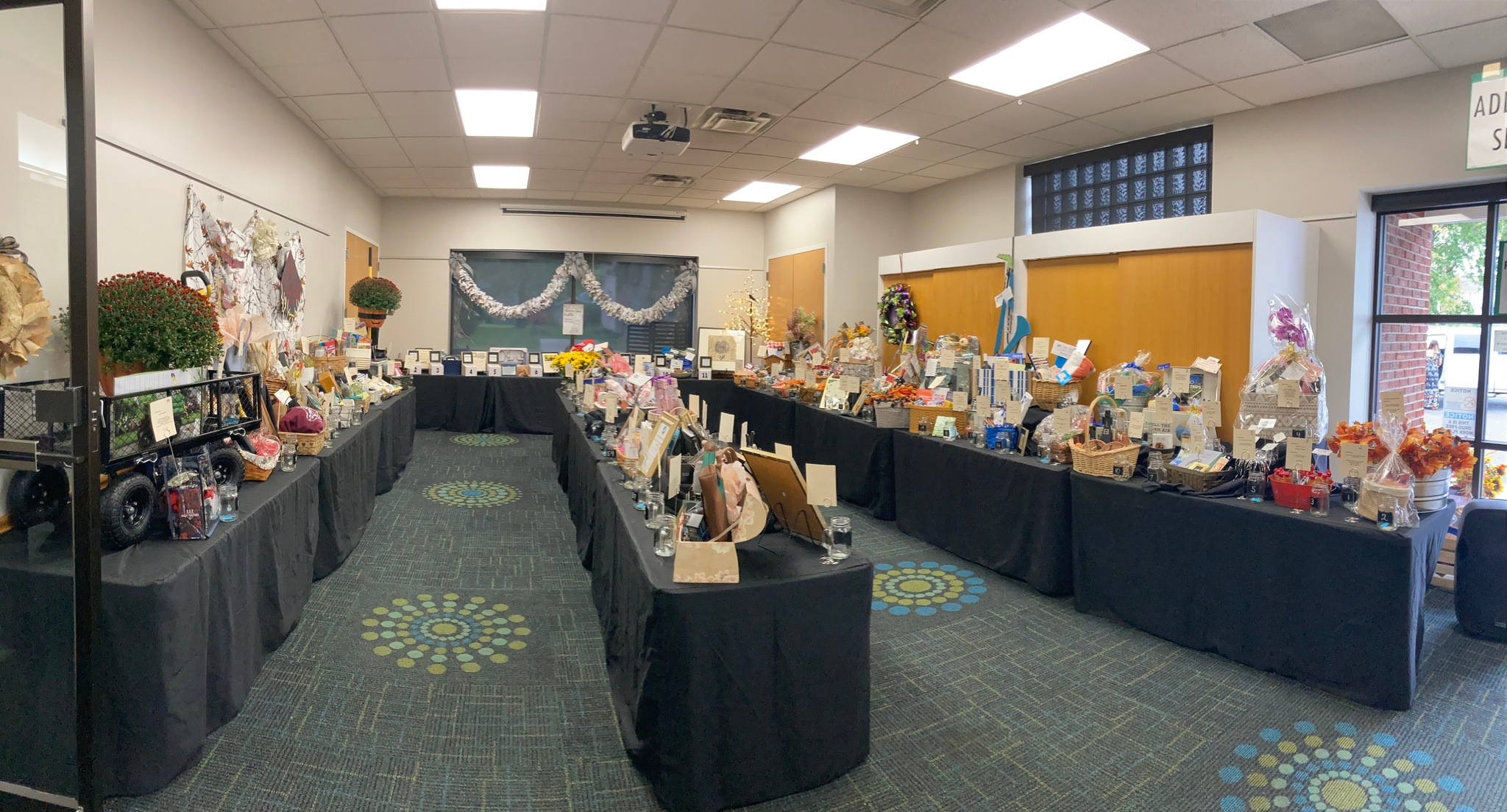 Here we see most of the 91 raffle baskets set up in the Community Room.